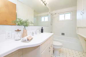 Main floor bathroom with tub & showered