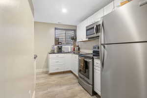 Full kitchen with stainless steel appliances