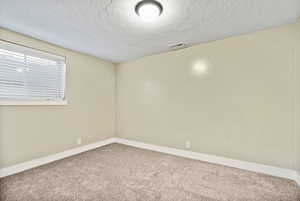 Basement bedroom newly painted and carpet