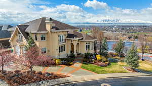 View of front of house with a front yard and a mountain view