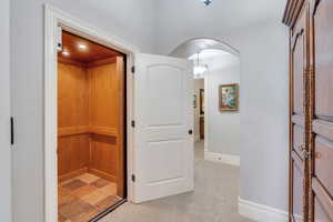 Hallway with light colored carpet