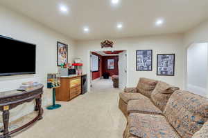 Living room featuring light colored carpet