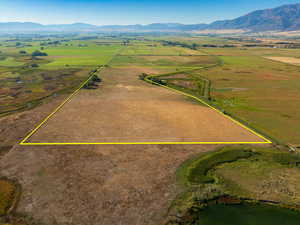 Birds eye view of property with a mountain view and a rural view