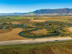 Drone / aerial view featuring a rural view and a water and mountain view