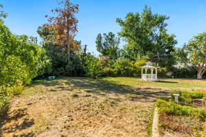 Side entry to large backyard with Gazebo