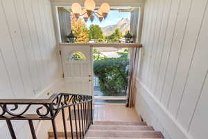 Bright entry with wide staircase and mountain views