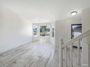 Spare room featuring light wood-type flooring