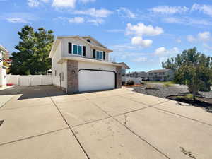 View of front of property featuring a garage