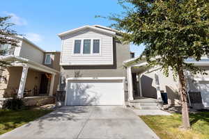 View of property featuring a garage