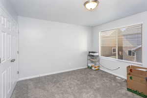 Unfurnished bedroom featuring a closet and carpet floors