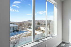 Doorway to outside with a mountain view and a wealth of natural light