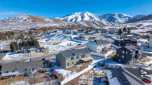 Snowy aerial view with a mountain view