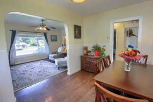 Dining room with ceiling fan and dark hardwood / wood-style flooring