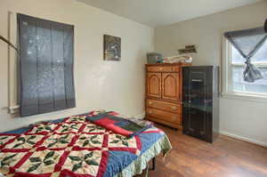 Bedroom featuring dark hardwood / wood-style flooring