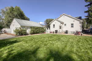 Exterior space with a lawn and a patio