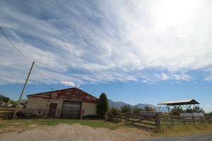 Exterior space featuring an outbuilding and a mountain view