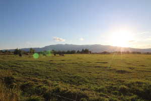 Property view of mountains with a rural view