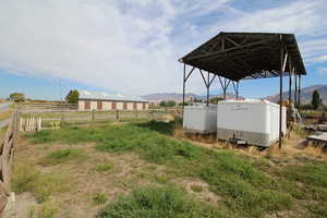 View of yard featuring a mountain view and a rural view