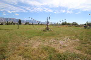 View of yard featuring a rural view and a mountain view