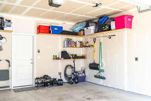 Garage with additional shelving and storage