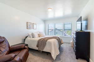 Master suite featuring light colored carpet