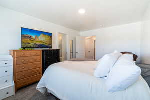 Bedroom with carpet and a closet