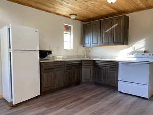 New kitchen with granite counters and wood stained cabinets