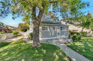 View of rear of property featuring patio area and private side entrance to upstairs mother-in-law.