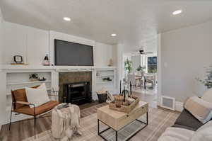 Living room with built in shelving and fireplace.