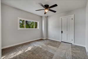 Upstairs Mother-in-law carpeted room with one walk in closet.