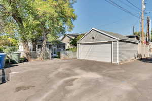 View of garage and parking in rear on private drive.