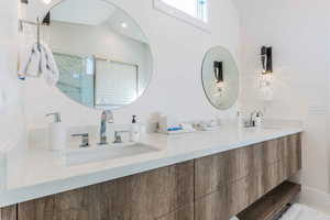 Bathroom with a shower and vanity