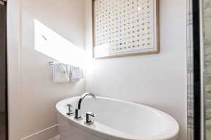 Bathroom with a tub to relax in