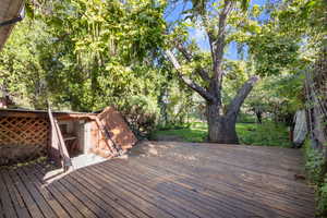 View of wooden deck - freshly stained, outlet for spa/hot tub