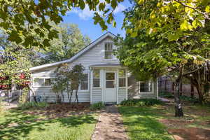 View of front of property with a front lawn