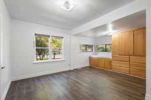 Unfurnished bedroom featuring a textured ceiling and LVP / wood-style flooring