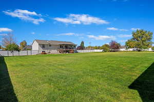 View of yard featuring a wooden deck