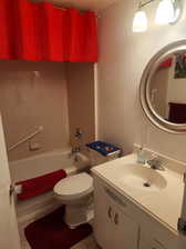 Full bathroom with tub / shower combination, vanity, and toilet