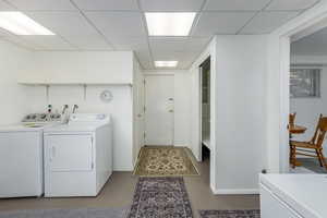 Washroom featuring washing machine and clothes dryer