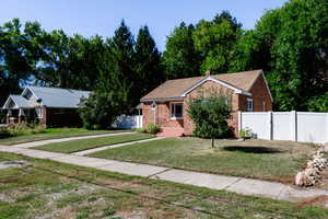 View of front of property with a front lawn