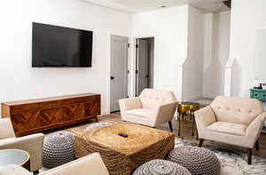 Living room with light hardwood / wood-style floors