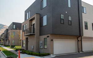 View of building exterior with a garage