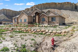 View of front of house with cooling unit