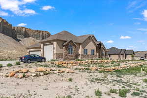 View of front facade featuring a garage