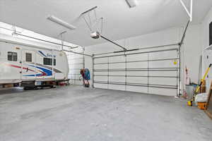 Garage featuring a garage door opener