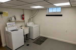 Washroom with washing machine and clothes dryer