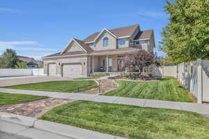 Craftsman house with a front lawn