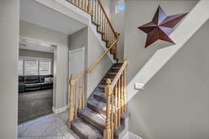 Stairs featuring carpet flooring