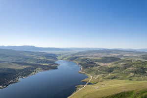 Bird's eye view with a water and mountain view