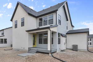 View of front of property with cooling unit